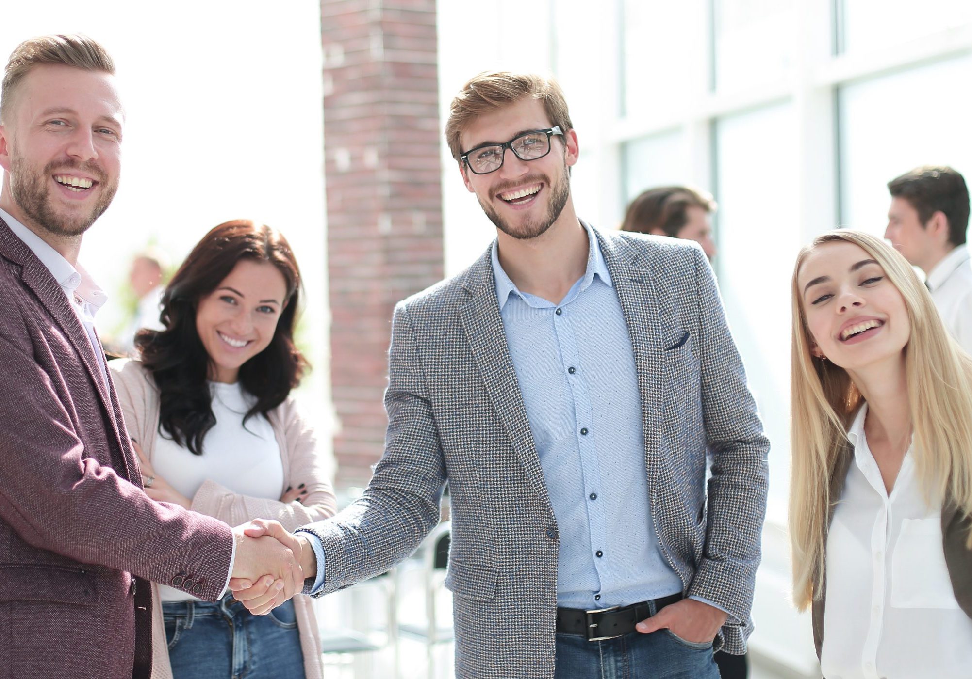 business partners shaking hands, greeting each other.